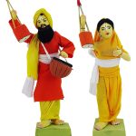 indian artisan hand making clay indian singer couple  dolls